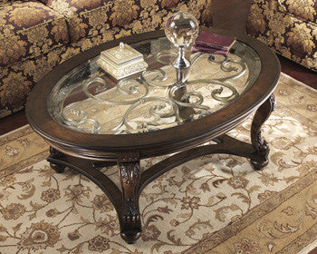 Ashley T499-0 Norcastle Oval Cocktail Table Dark Brown